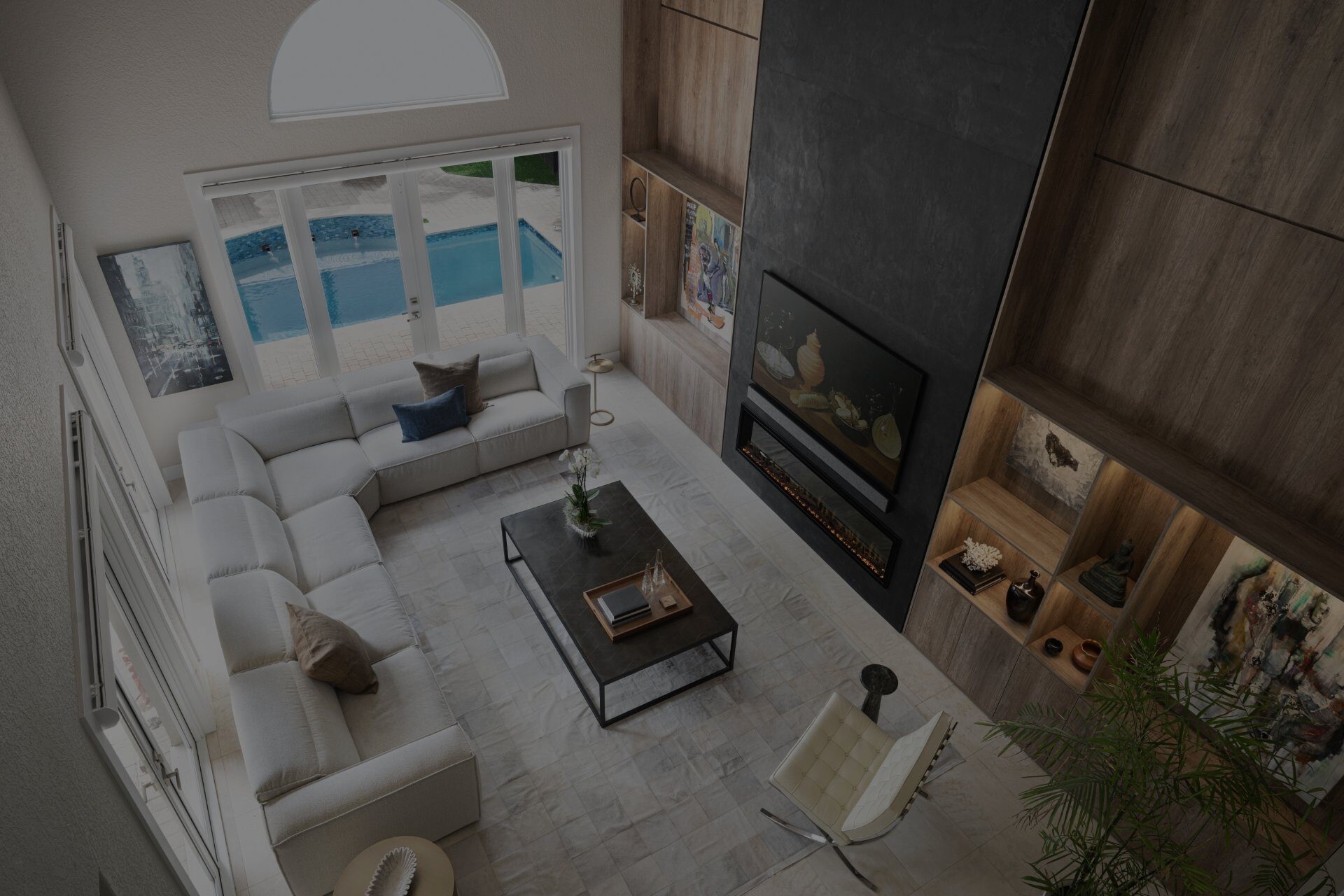Living room with fireplace and pool view, from above